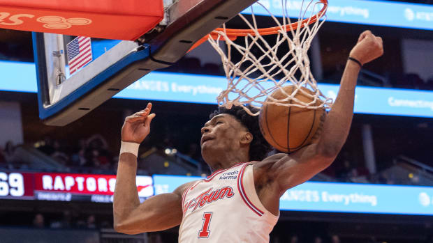 Rockets forward Amen Thompson dunks against the Toronto Raptors in the third quarter at Toyota Center.
